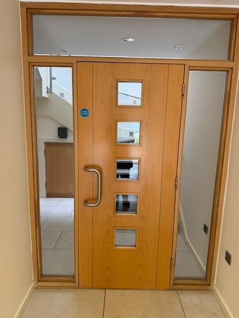 Communal entrance door with access control in a managed block